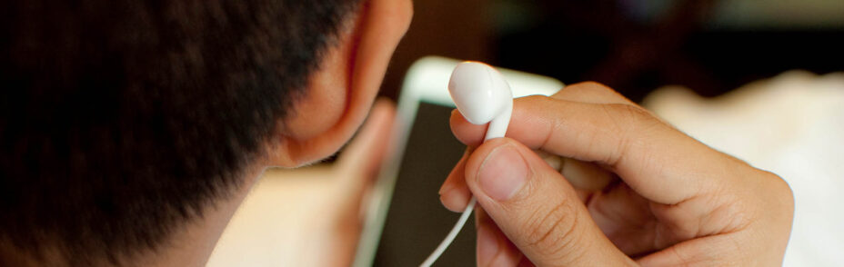 Picture of A man is listening to podcast indoors
