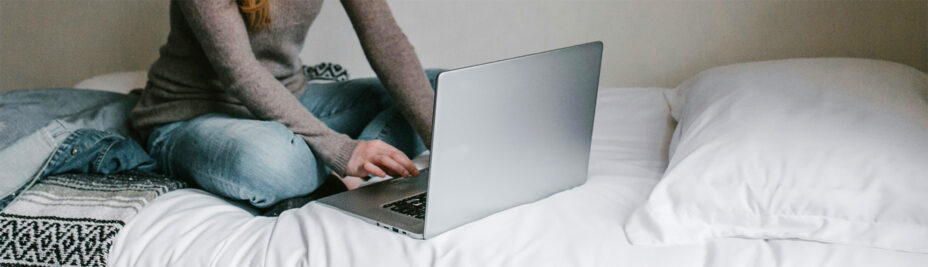 Picture of someone typing on a laptop
